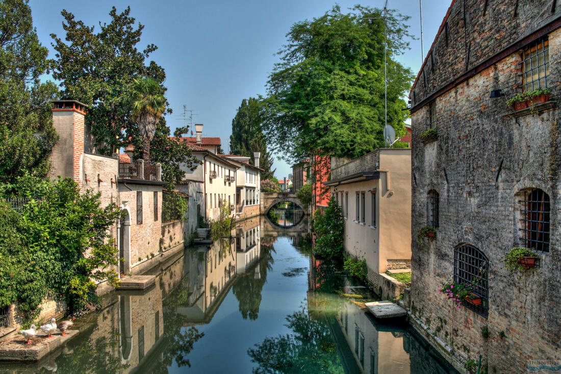 A picturesque view of the canal connecting the two streams of the Lemene River in Portogruaro